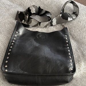 Elegant Black Leather Shoulder Bag with Studded Accents